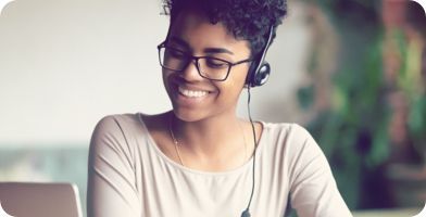 Photo of a person with a headset on giving employment law advice
