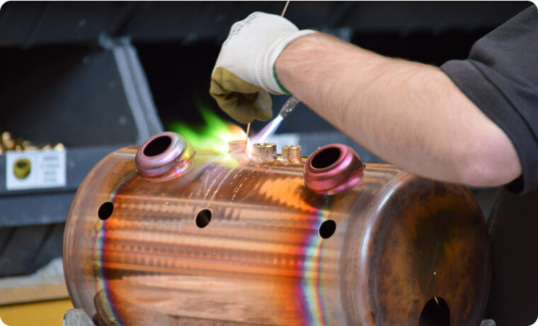 Photo of a Fracino employee building a coffee machine part